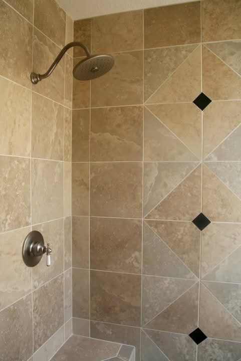 Shower with diamond-shaped accent tiles in a geometric pattern